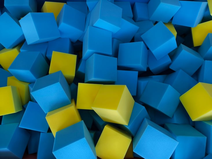 Collection of foam blocks in various shades of blue and yellow 