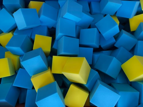 Collection of foam blocks in various shades of blue and yellow 
